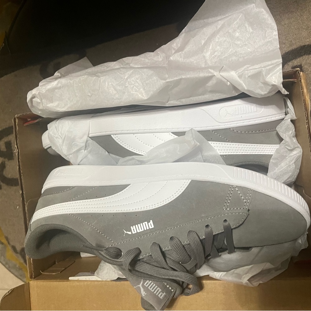 Puma grey suede sneakers. New with tags and box.
